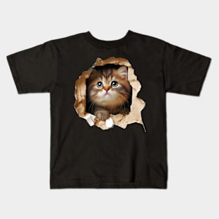 Darling kitty squeezing through a hole in the wall Kids T-Shirt